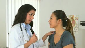 stock-footage-female-hispanic-doctor-advises-asian-patient