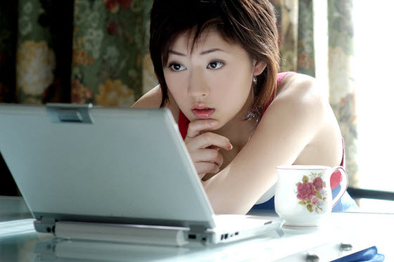 pretty-asian-woman-using-laptop-computer